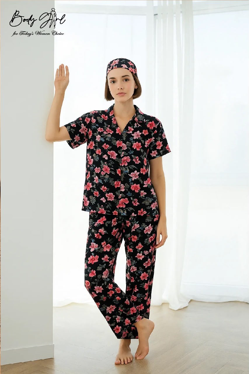 Woman wearing a floral pajama set in a bright room