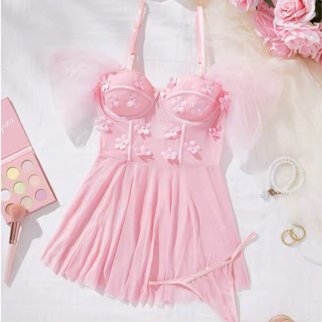 Pink lingerie set with floral details on a white background