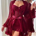 Red lace lingerie set with matching robe against a neutral background