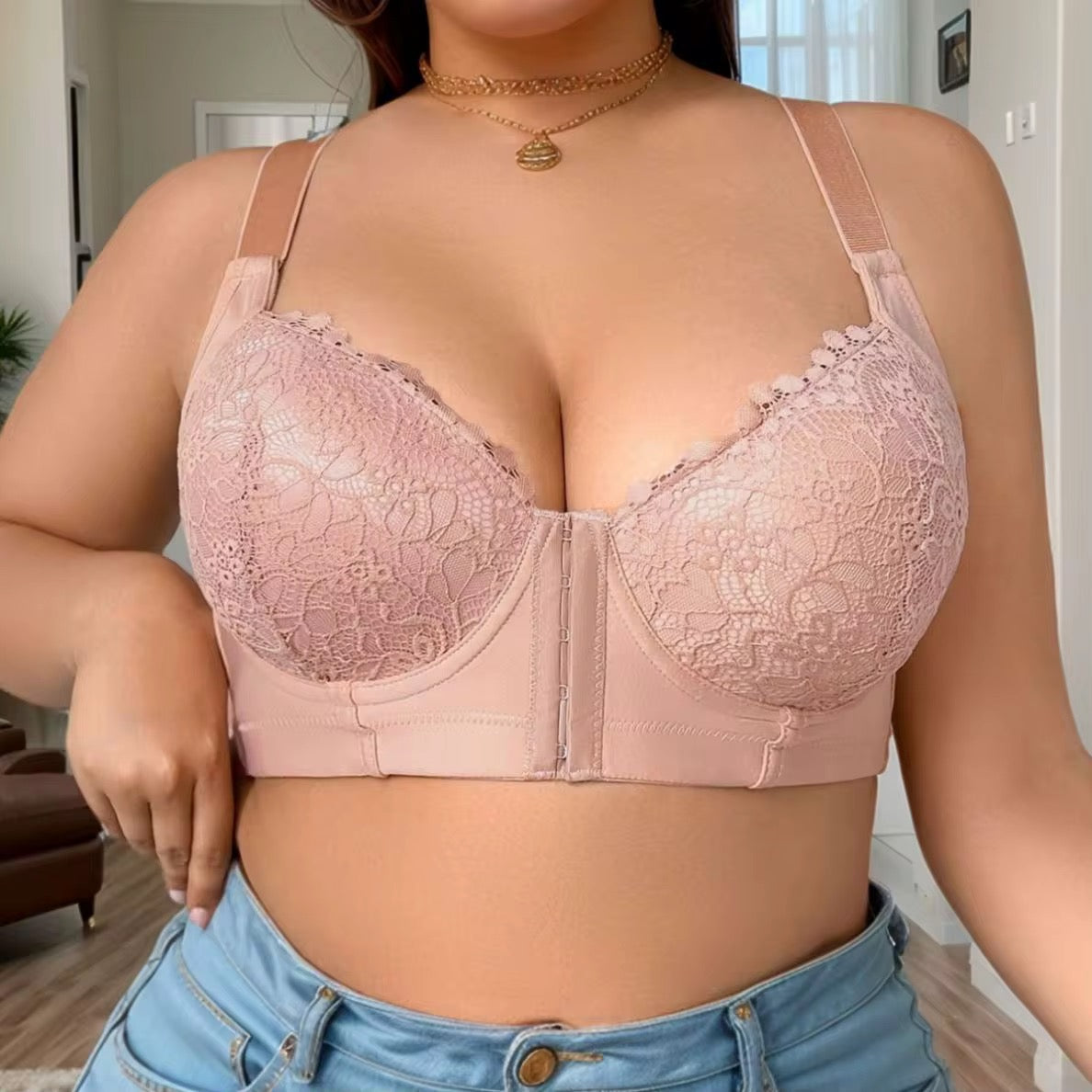 Person wearing a pink lace bralette in a casual setting