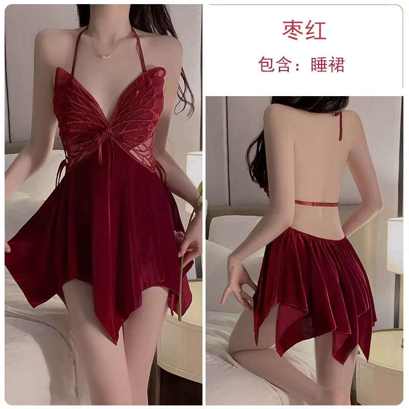 Red lingerie set with butterfly details on a neutral background