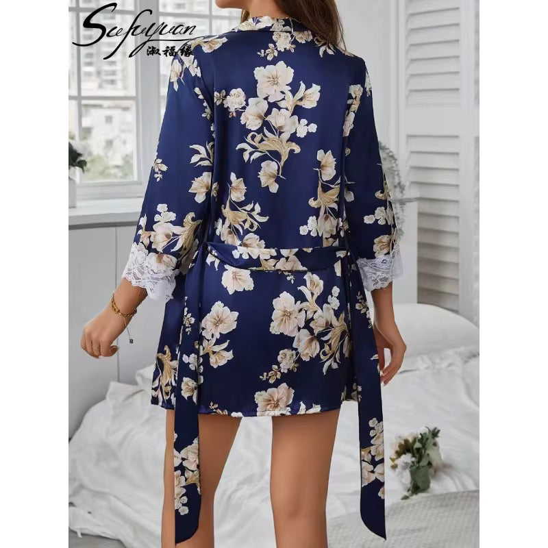 Woman wearing a navy floral robe in a bedroom setting