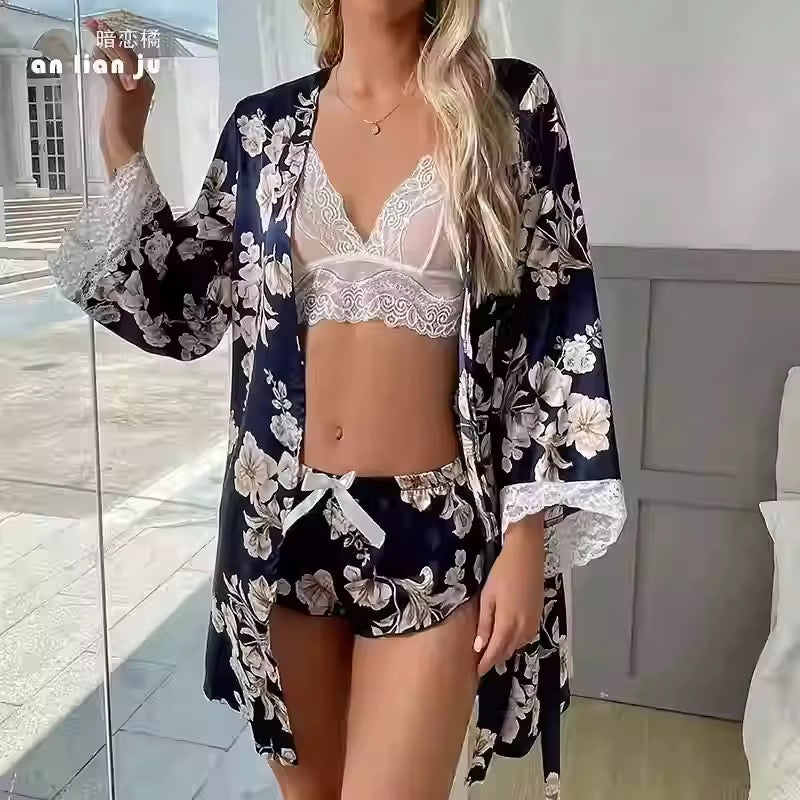 Woman wearing a floral kimono and white lingerie in a bright room.