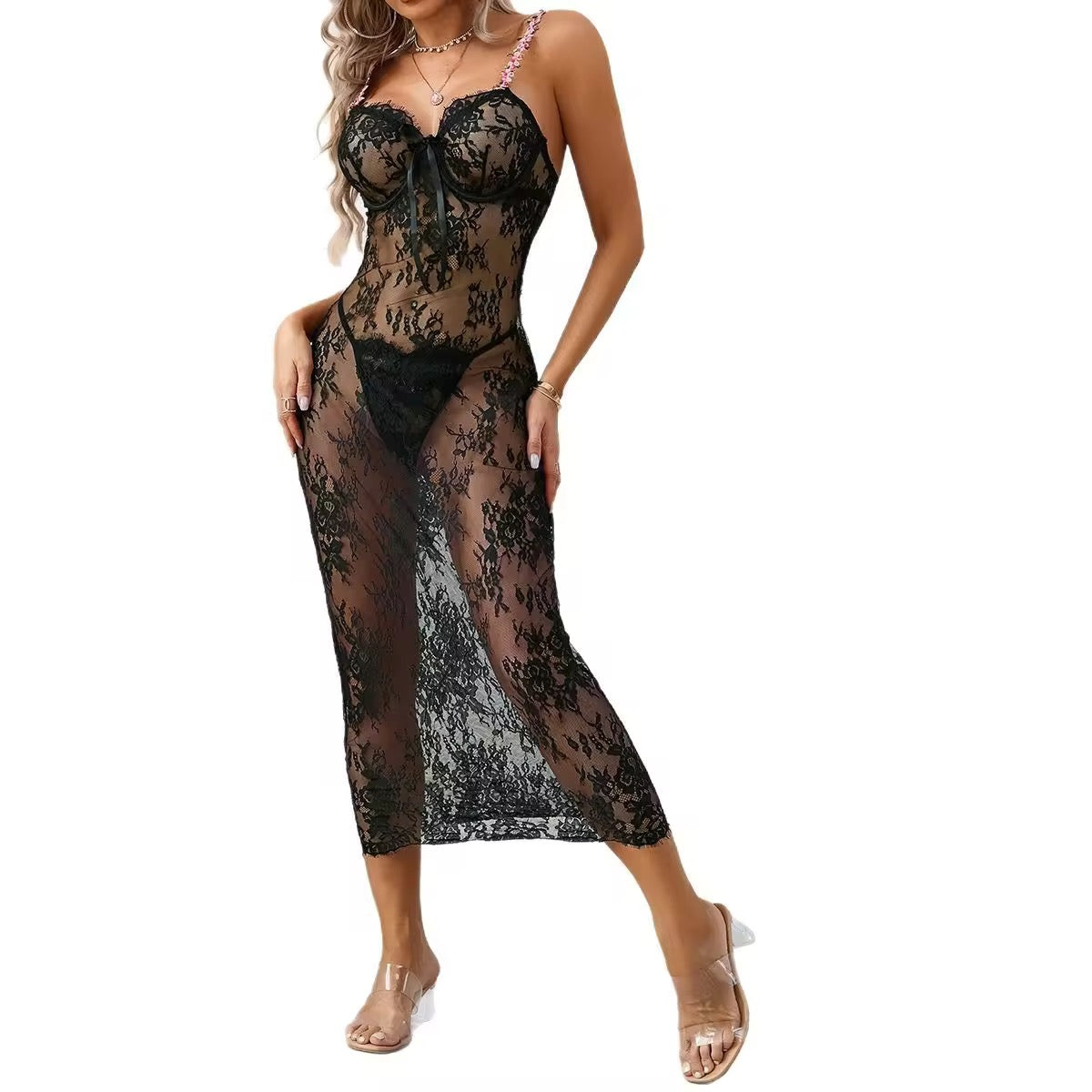 Black lace dress worn by a model on a white background