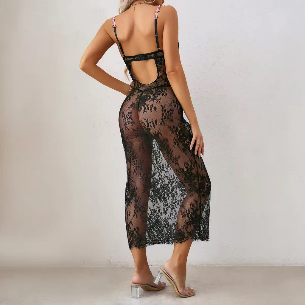 Black lace dress worn by a model against a plain background