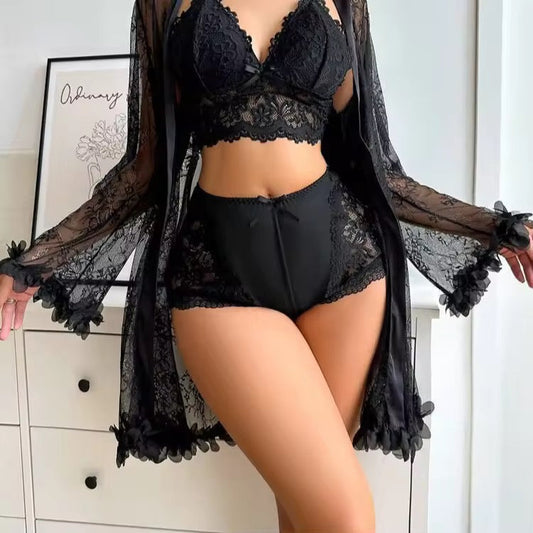 Person wearing black lace lingerie set with a sheer black robe.