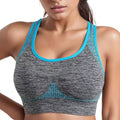 Gray sports bra with blue trim worn by a person on a white background