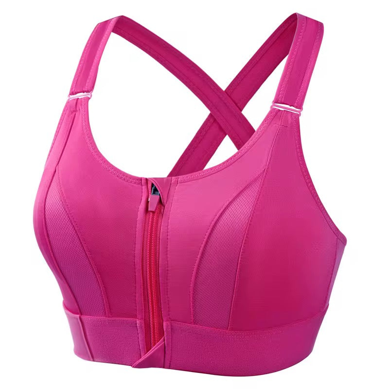 Pink sports bra with a zipper on a white background
