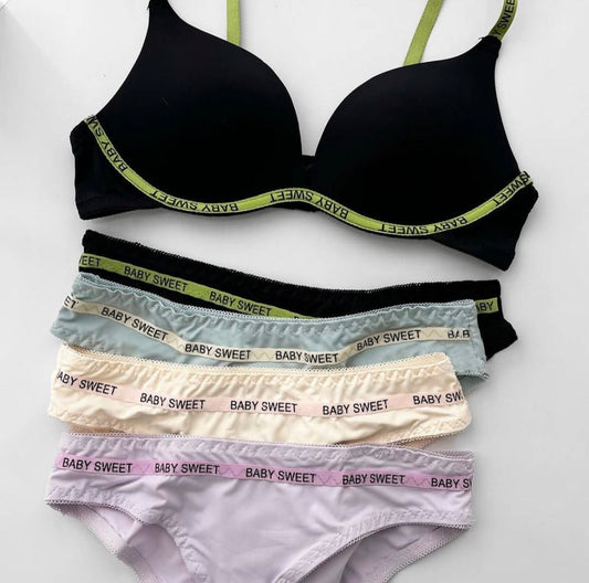 Black bra and panties set with 'Baby Sweet' branding on a white background