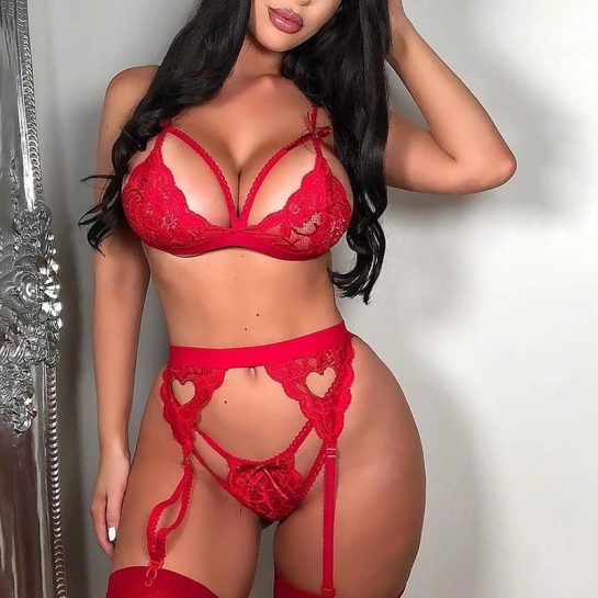 "A woman wearing a sexy red garter lingerie set from mskoleksiyon's online store."