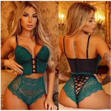 A model wearing a two-piece emerald green lace lingerie set.